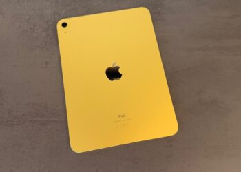 Tenth-generation iPad in yellow lying face down on a dark surface, iPad shipments declined in the second quarter