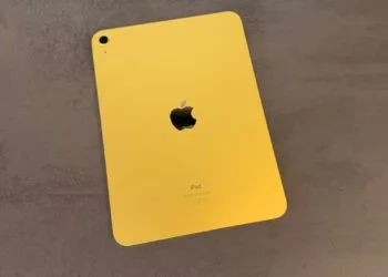 Tenth-generation iPad in yellow lying face down on a dark surface, iPad shipments declined in the second quarter