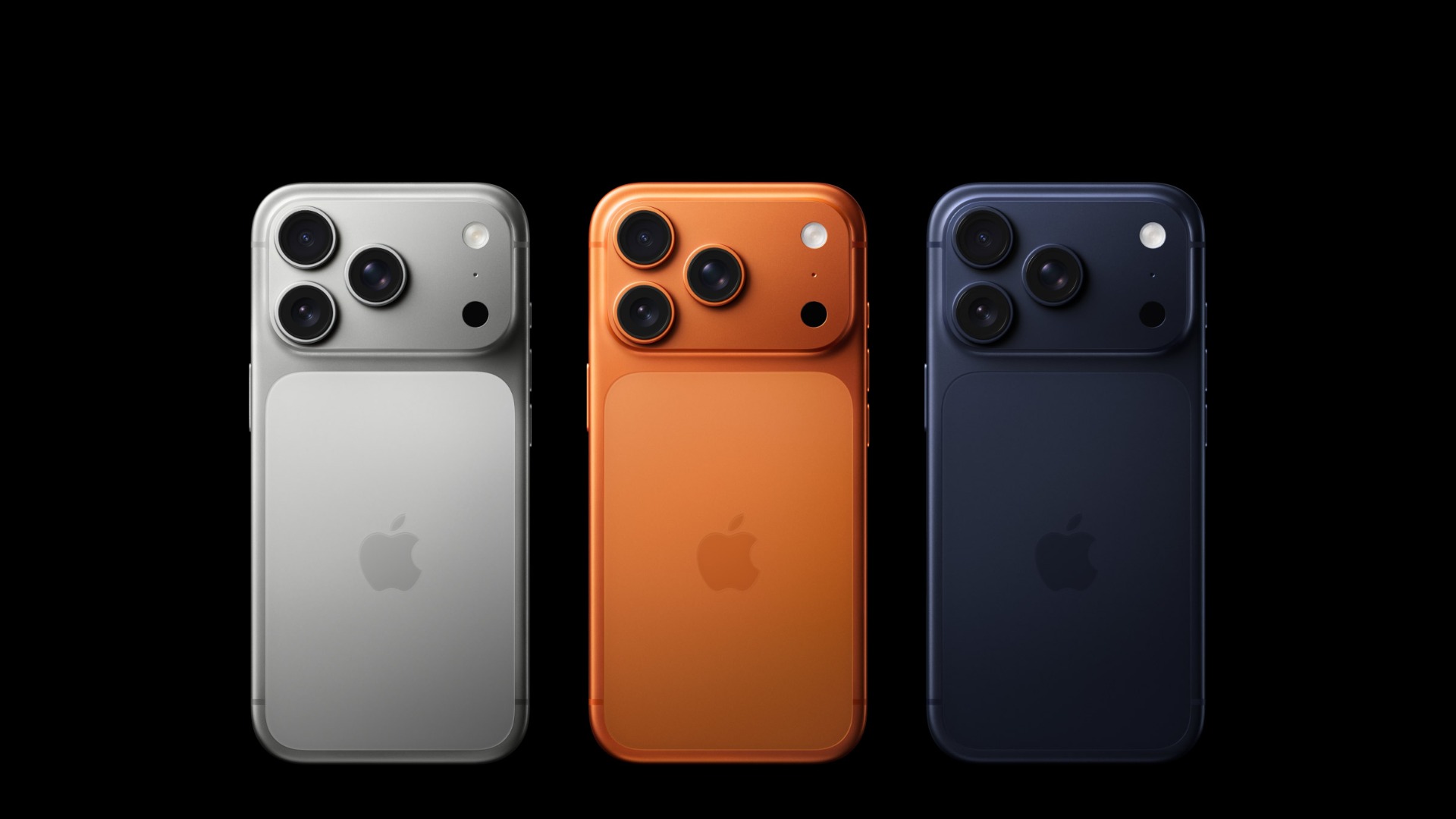 Three iPhone 17 Pro seen from the back side by side in silver, orange and blue, whose successor iPhone 18 Pro could launch with longer delivery times