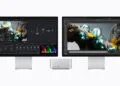 Mac Studio M5 Ultra between two Studio Displays running video editing and 3D software