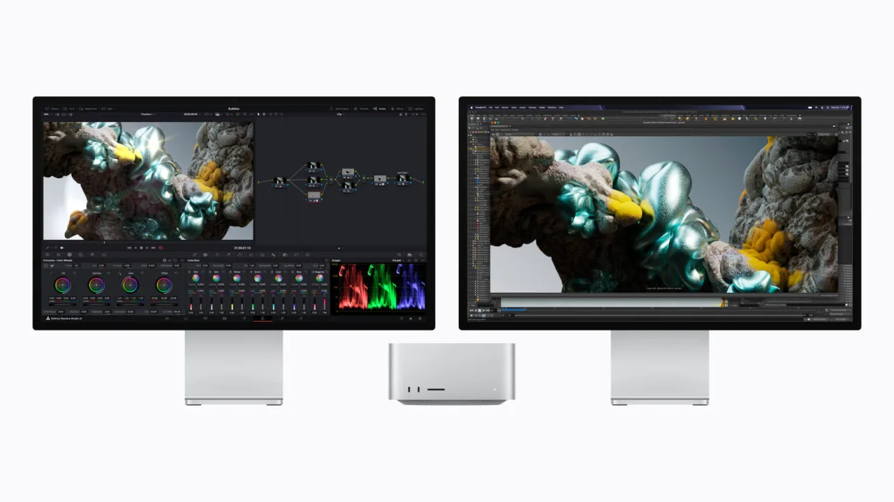 Mac Studio M5 Ultra between two Studio Displays running video editing and 3D software