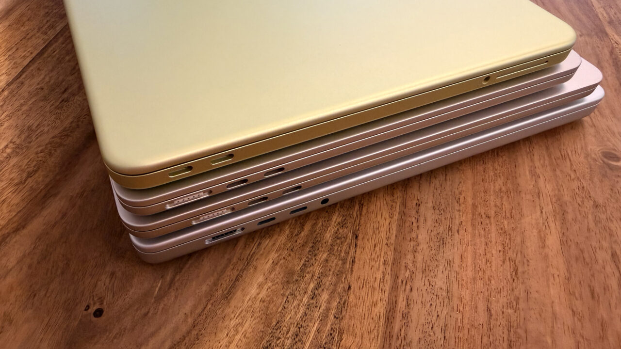 Four stacked MacBooks seen from the port side with MagSafe 3 and USB-C, where each model needs a different MacBook power adapter for full charging speed
