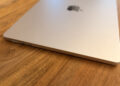 A closed 15-inch MacBook Air on a wooden table – macOS 26.7 contains code names for unreleased Apple devices.