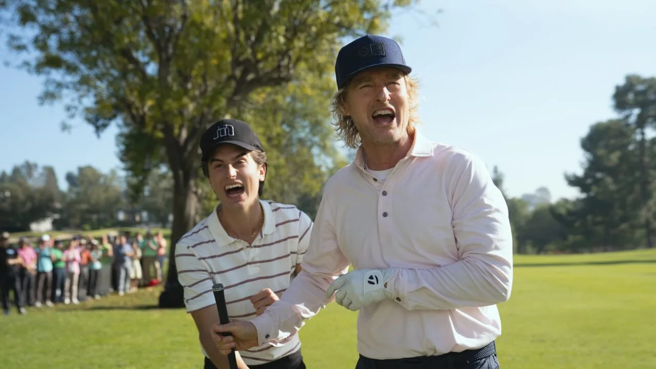 Owen Wilson and Peter Dager celebrating on the golf course in season two of Stick