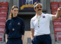 Ted Lasso standing beside a coach in the empty AFC Richmond stadium while Apple has yet to decide on Ted Lasso season 5