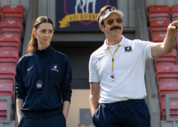 Ted Lasso standing beside a coach in the empty AFC Richmond stadium while Apple has yet to decide on Ted Lasso season 5