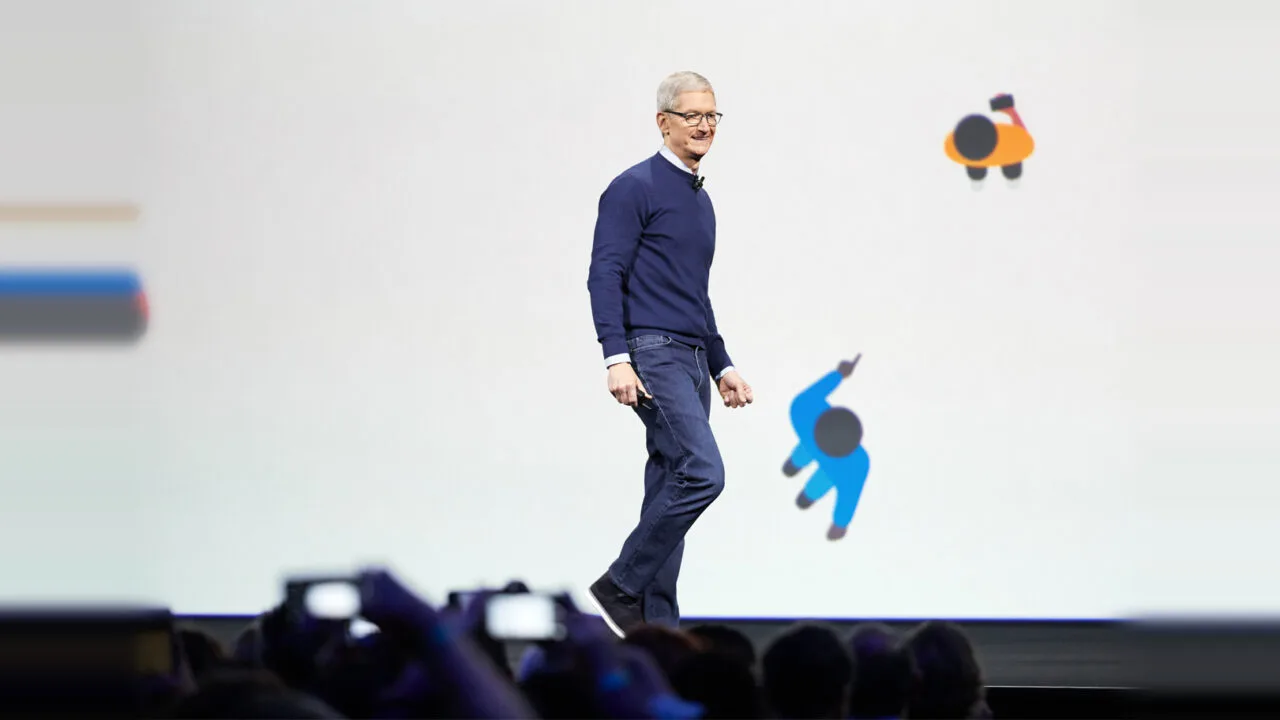 Tim Cook walking across the stage at an Apple developer conference – taking stock after 15 years as Apple CEO