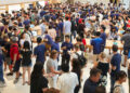 Customers crowding an Apple Store as the US smartphone market lost five percent in sales during the second quarter
