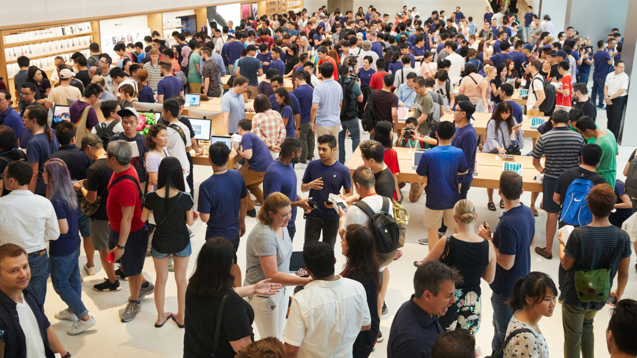 Customers crowding an Apple Store as the US smartphone market lost five percent in sales during the second quarter