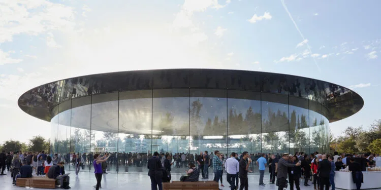 Crowd outside the glass Steve Jobs Theater at Apple Park; the iPhone 18 Pro event can be watched live worldwide