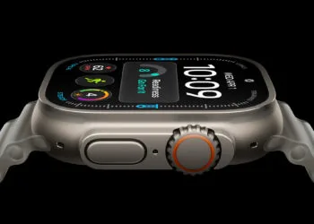 Apple Watch Ultra 4 titanium case seen from the side, watch face showing the readiness score and heart rate
