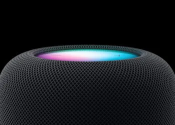 HomePod Siri AI: top of a midnight HomePod with a glowing Siri light in pink and turquoise against a black background