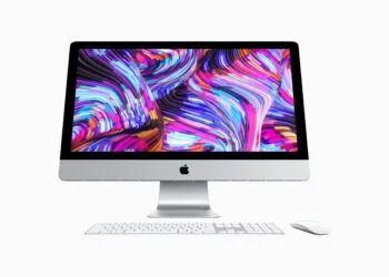Vintage iMac model, front view with keyboard and mouse
