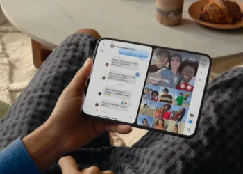 iOS 27 iPhone Duo: opened foldable iPhone showing Messages and Photos side by side in Split View