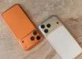 Two iPhones side by side on light marble as iPhone Handoff runs both under one phone number