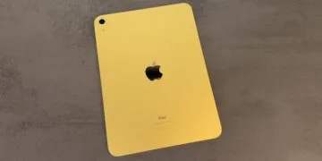 Yellow entry-level iPad seen from the back on a grey stone surface – for the code finding on the iPad mini 8 and iPad 12