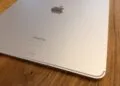 Back of an iPad Pro on wood, the model whose OLED demand is below plan