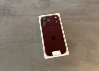 iPhone 18 Pro teardown: iPhone 18 Pro in burgundy inside its opened box