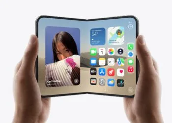Unfolded iPhone Duo held in two hands in landscape orientation, the inner display showing the Home Screen with widgets and app icons