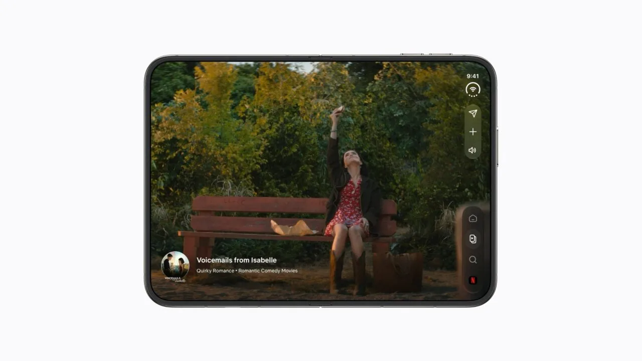 iPhone Duo crease: unfolded iPhone Duo in landscape playing a film on the inner display, with the hinge running through the centre of the device
