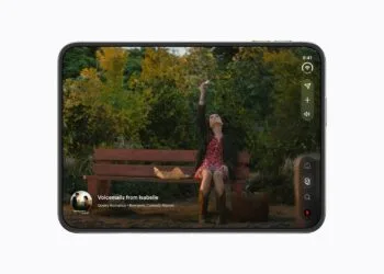 iPhone Duo crease: unfolded iPhone Duo in landscape playing a film on the inner display, with the hinge running through the centre of the device