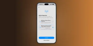iPhone showing the Set Up eSIM screen with the option to use the number on two iPhones selected, the first step to set up iPhone Handoff