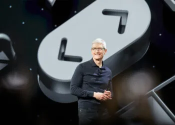 iPhone Ultra Tim Cook: Apple CEO on a keynote stage in front of a large clock symbol