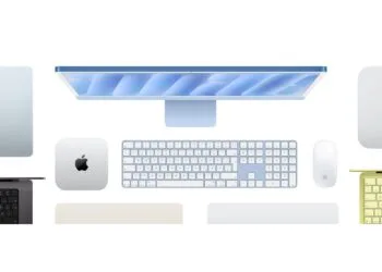 Mac buying guide: top view of a blue iMac with keyboard and mouse, next to a Mac mini, other Macs and MacBooks in several colours