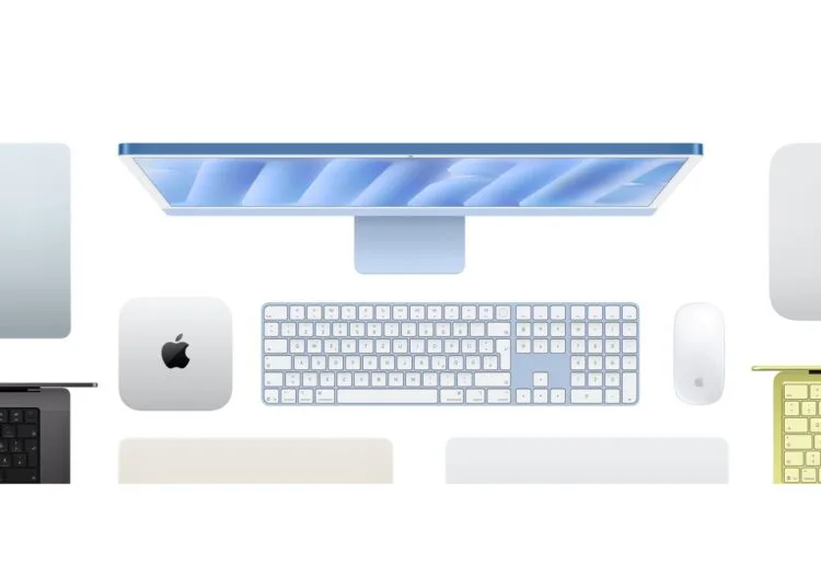 Mac buying guide: top view of a blue iMac with keyboard and mouse, next to a Mac mini, other Macs and MacBooks in several colours