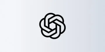 OpenAI pauses training: black OpenAI blossom on a light grey gradient