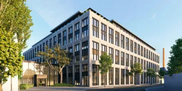 Apple 6G: Rendering of Apple's building for its Silicon Design Center in Munich with a glass entrance and trees