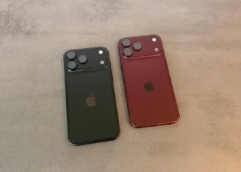 Apple stock price target: two iPhone 18 Pro Max in black and burgundy lying face down on a grey stone surface