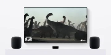 Apple TV HomePod: Apple TV 4K in front of a TV with a HomePod on each side as a stereo pair
