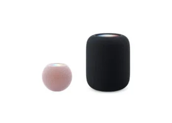 HomePod mini vs. HomePod: HomePod mini 2 in pink next to the much larger HomePod 2 in midnight, both shown to scale side by side