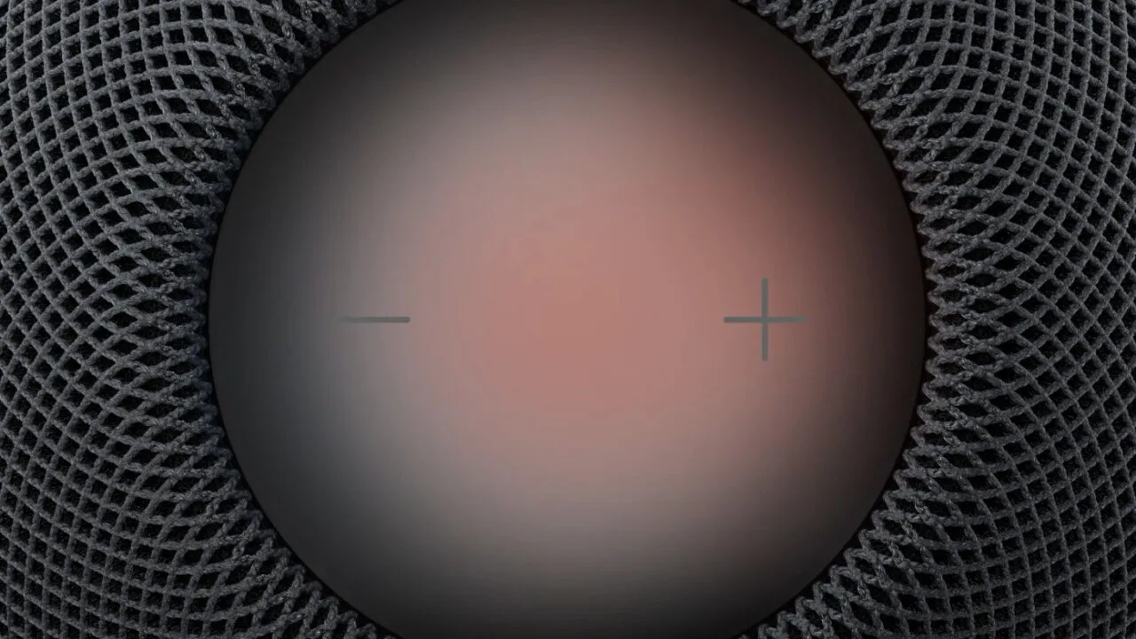 HomePod Sound Glow: top of a HomePod with a reddish glowing touch surface, plus and minus symbols and dark mesh around it