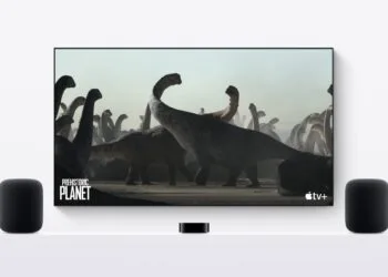 HomePod stereo pair: two HomePods on either side of a TV, with an Apple TV in the middle on a white sideboard