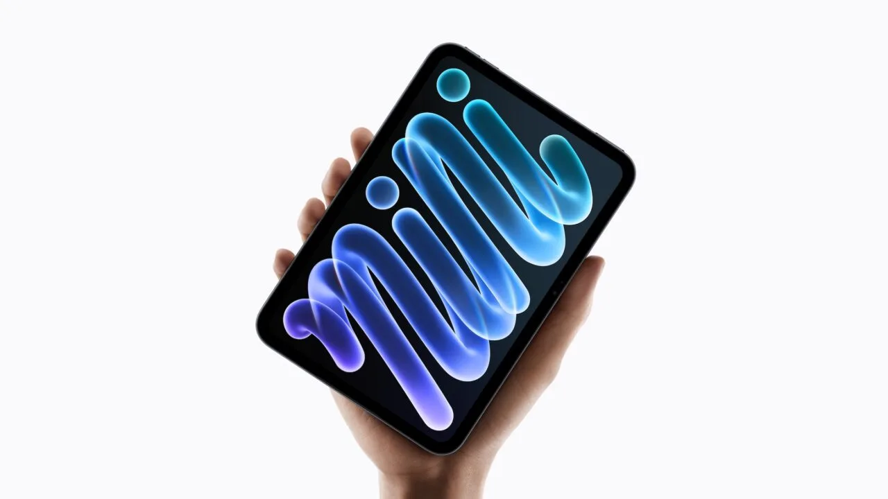 The iPad mini A20 Pro with OLED display held in one hand