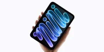 The iPad mini A20 Pro with OLED display held in one hand