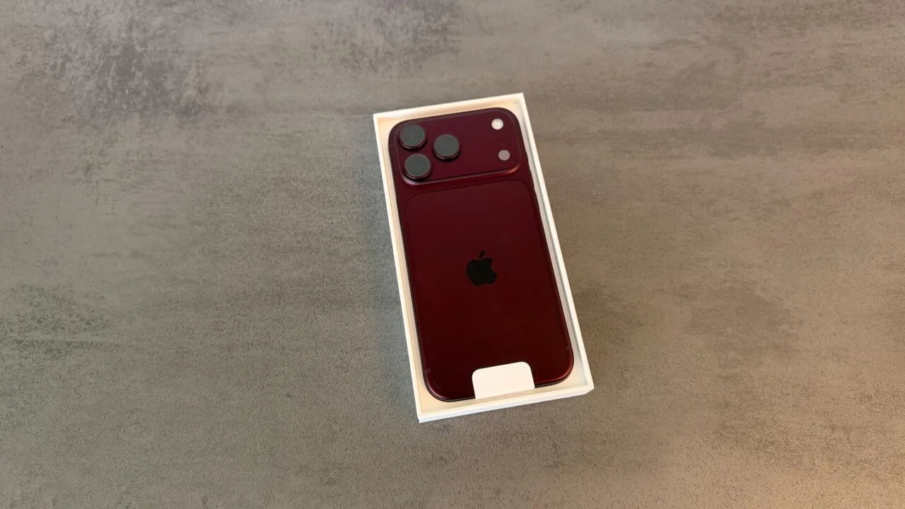 iPhone 18 Pro sales: a burgundy iPhone 18 Pro lies back side up in its open white box on grey stone