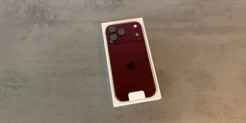 iPhone 18 Pro sales: a burgundy iPhone 18 Pro lies back side up in its open white box on grey stone