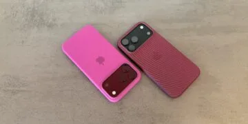 iPhone market share: two iPhone 18 Pro Max in pink and berry-red cases on a grey stone surface