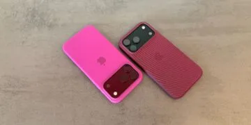 iPhone market share: two iPhone 18 Pro Max in pink and berry-red cases on a grey stone surface
