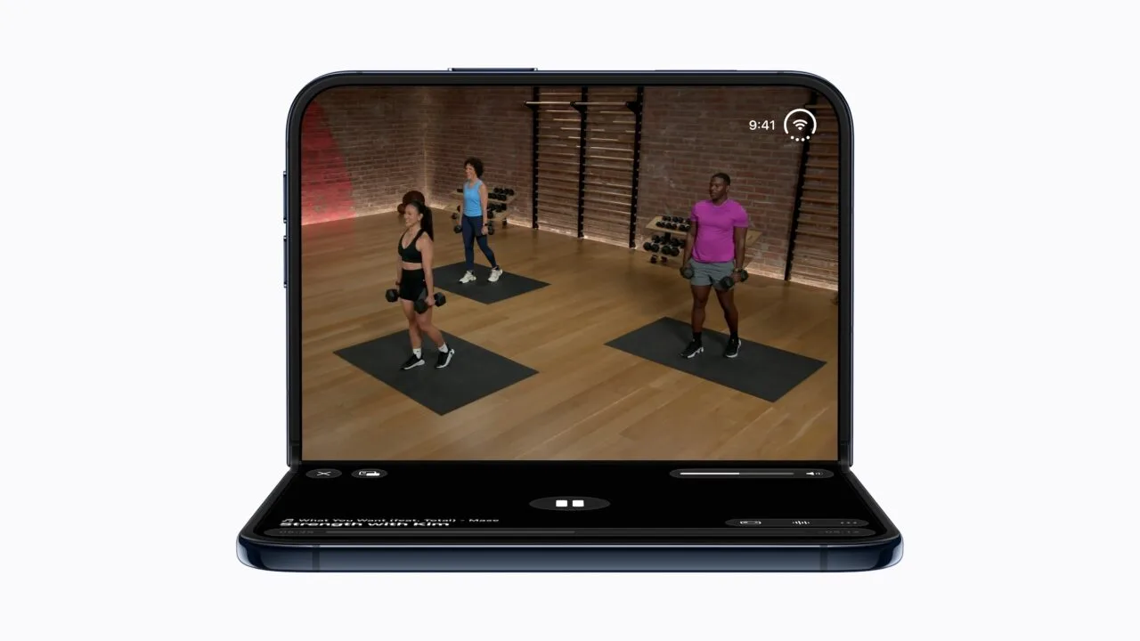 iPhone Duo battery: the half-open iPhone Duo shows a workout video with three people on the upper half and playback controls on the lower half