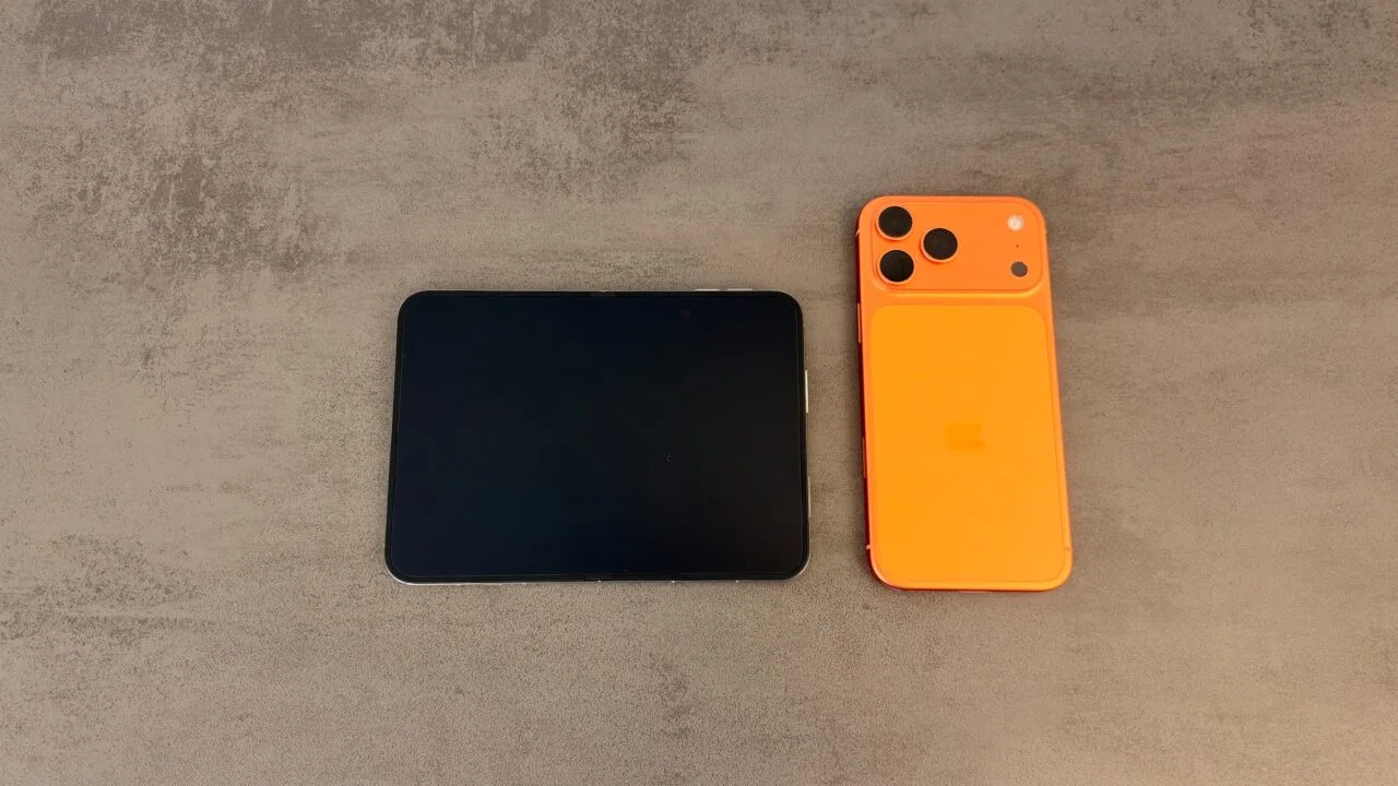 iPhone Duo unfolded next to an orange iPhone 17 Pro Max, a first impression of the difference in display size