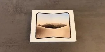 iPhone Duo market share: the iPhone Duo box showing the unfolded device on its lid, lying on a grey table