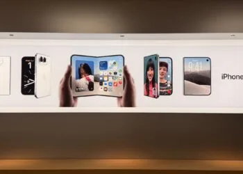iPhone Duo without pre-order: advertising banner in an Apple Store showing the iPhone Duo closed, unfolded in two hands and during a video call, with the product name on the right