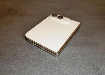 For the iPhone Duo repair manual: the folded iPhone Duo in Star White on a table, showing the back glass, camera, hinge and USB-C port.
