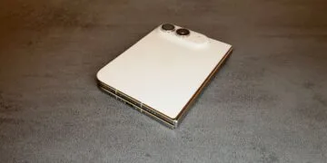 For the iPhone Duo repair manual: the folded iPhone Duo in Star White on a table, showing the back glass, camera, hinge and USB-C port.