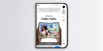 iPhone Duo Safari on the outer display: Apple's website fills only the left area, with the vertical bar holding the clock and controls on the right.