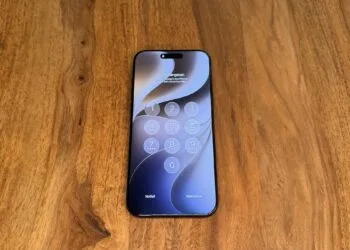 iPhone on a wooden table after a restart, asking for the passcode, the state the GrayKey maker claims to bypass
